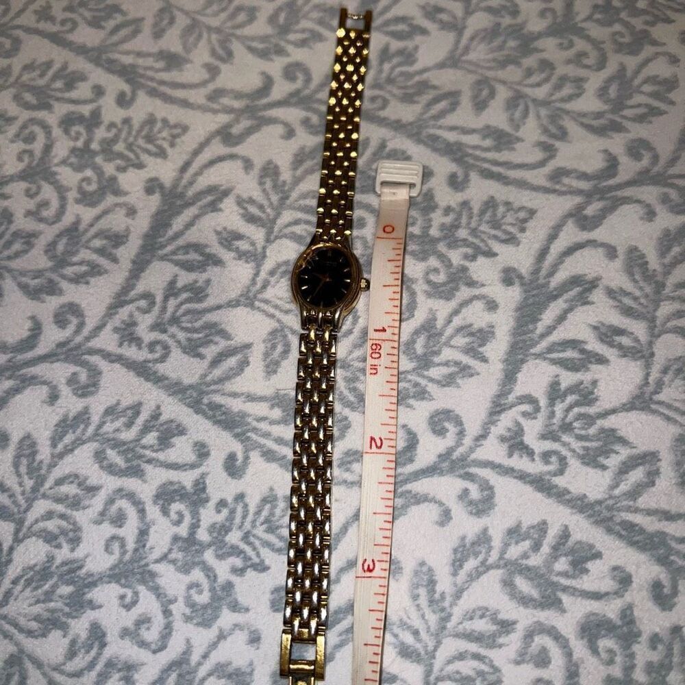 Bulova watch women’s style thin clock gold